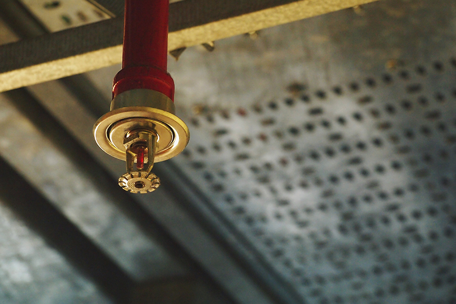 Fire Protection Contractor Insurance - Installation of an Automatic Fire Sprinkler System with Pipe in Red